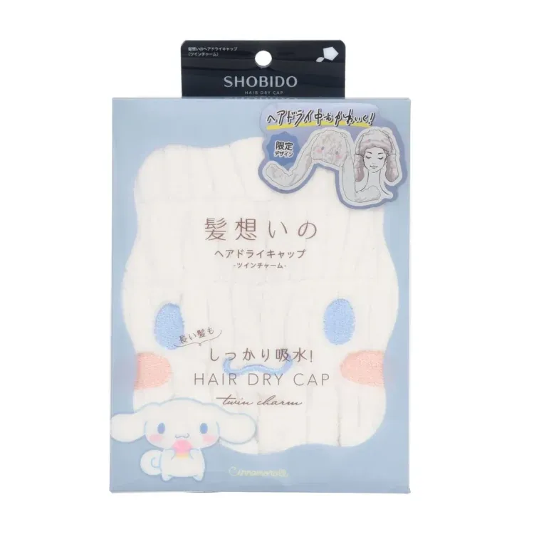 白いヘアドライキャップのパッケージ。パッケージには、Cinnamorollのイラストと、ヘアドライキャップを使用している女性のイラストが描かれています。